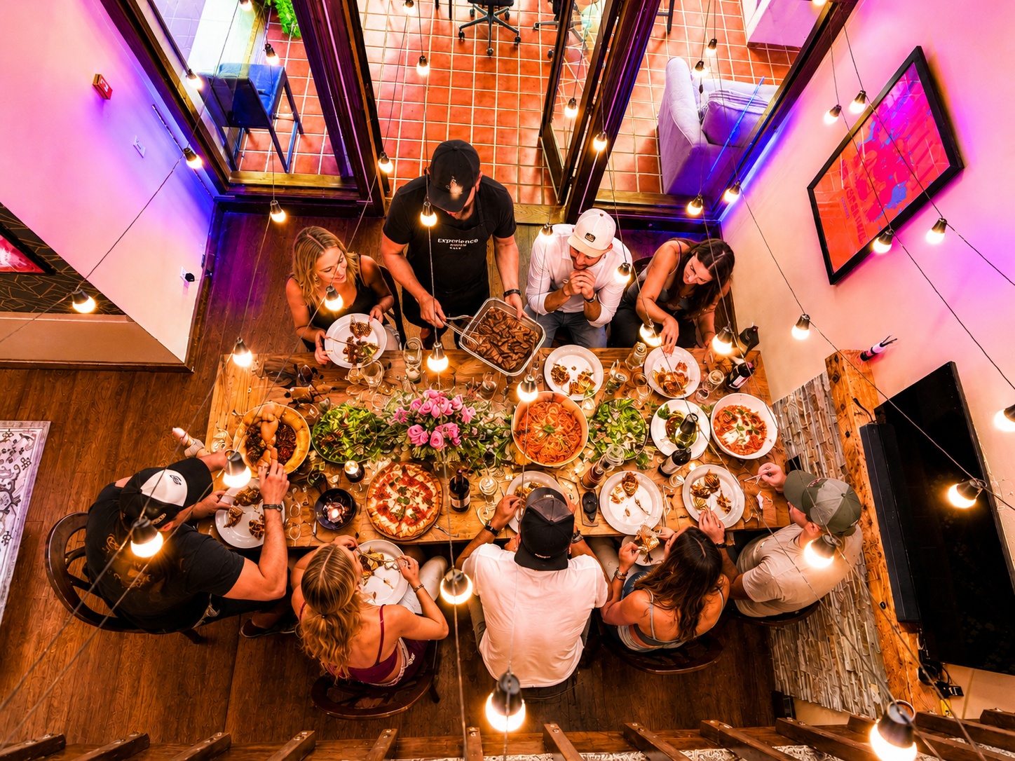 Ultimate Pizza Party spread with pizza, burgers and sides at a Denver holiday party